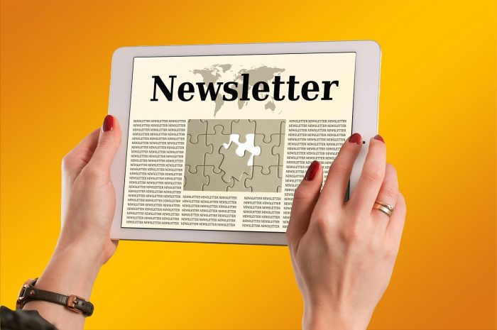 Hands Holding Newsletter Message Photo